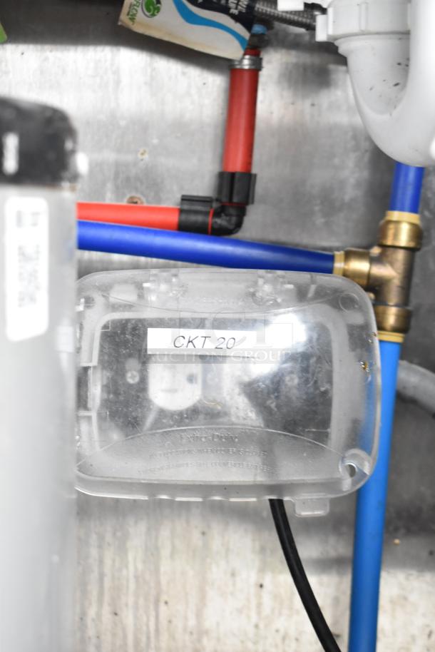 Connections and wires labeled "CKT 20" inside a commercial mobile kitchen trailer.