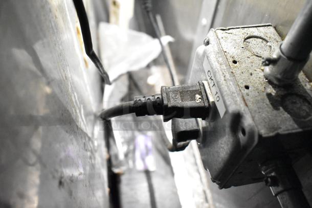 Electrical outlet in a commercial mobile kitchen trailer, labeled "CKT 10." Shows wear and signs of use.