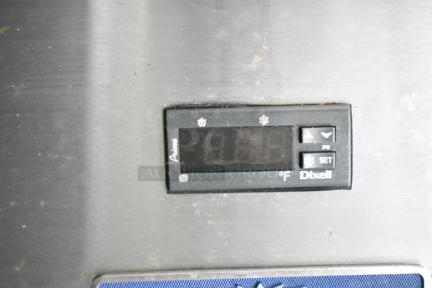 Digital temperature display on a Dixell control panel, showing settings for refrigeration in a commercial kitchen trailer.