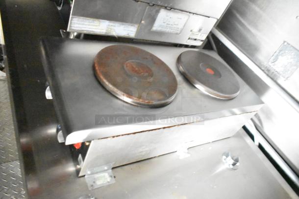 Commercial mobile kitchen trailer with CaptiveAire hood, Pitco propane fryers, and full refrigeration package.