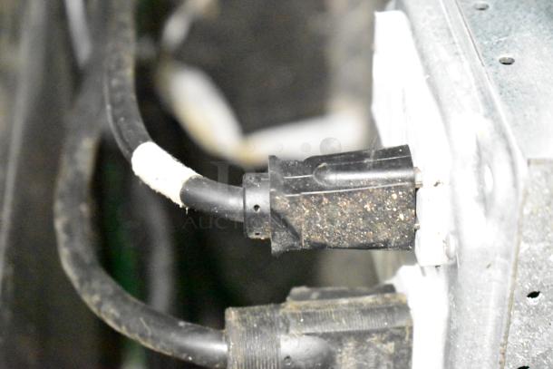 Electrical connection on a commercial mobile kitchen trailer featuring a CaptiveAire Hood System and Pitco Propane Fryers.