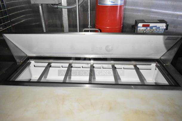 Fully equipped commercial mobile kitchen trailer with CaptiveAire hood, Pitco propane fryers, and refrigeration package.