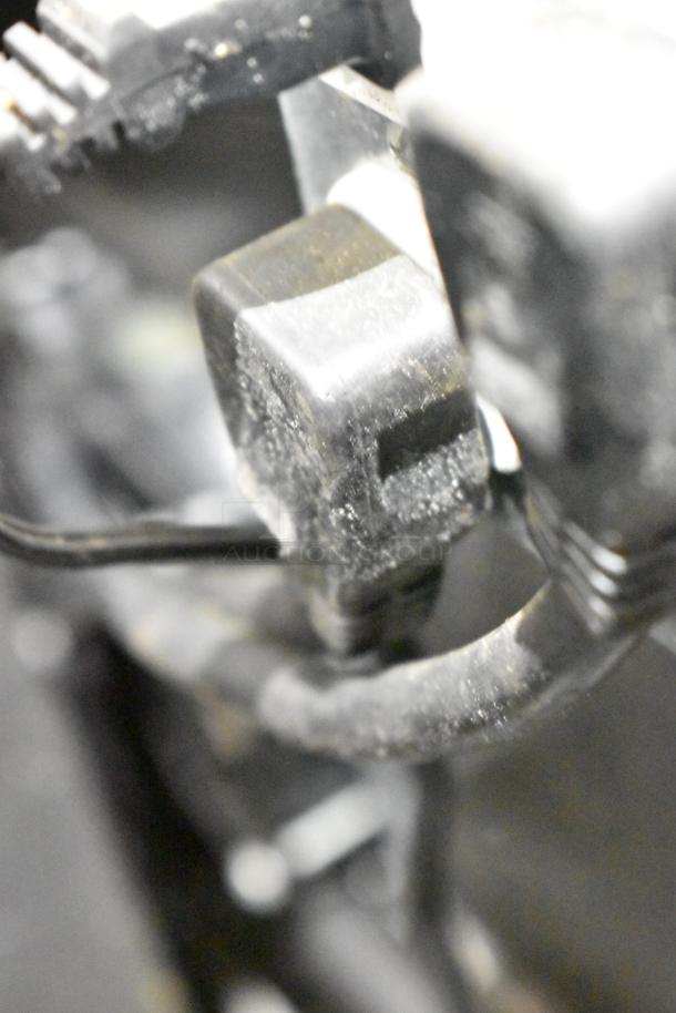 Close-up view of electrical connections on a commercial mobile kitchen trailer. Dust visible on parts.