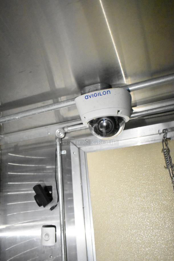A commercial mobile kitchen trailer interior with Avigilon security camera mounted on the ceiling.