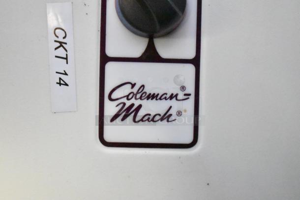 Coleman-Mach control panel with "CKT 14" label displayed, part of a commercial mobile kitchen trailer setup.