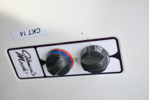 Control panel of Coleman Mach system with dual knobs; settings include temperature and fan speed. Labeled "CRT 14".