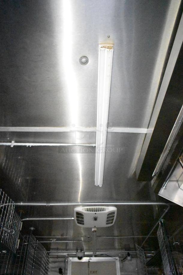 Ceiling view of a commercial mobile kitchen trailer with lighting and ventilation system.