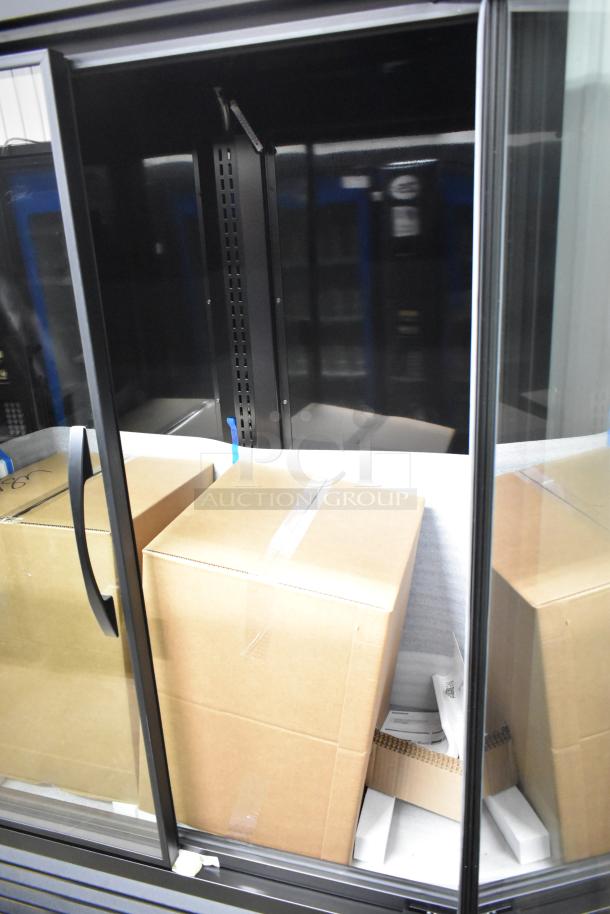 Brand new 2025 True TVM-48SL-HC 2-door cooler merchandiser. Scratch and dent. 115V, 1 phase. Cardboard boxes inside.