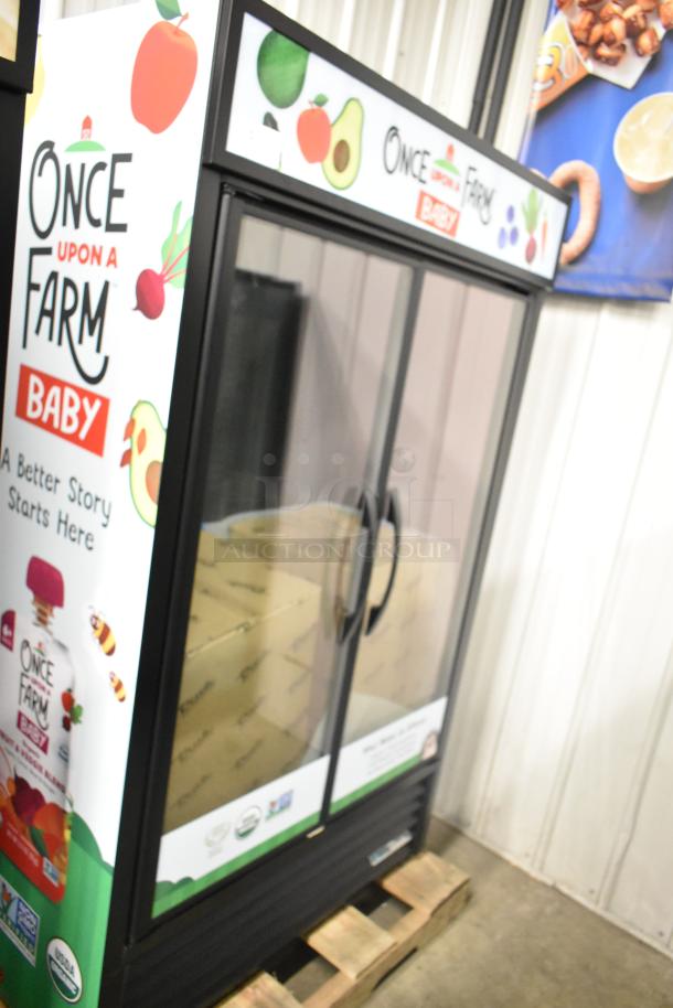 Brand new 2025 True TVM-48SL-HC Commercial 2-Door Reach-In Cooler Merchandiser with "Once Upon a Farm" branding.