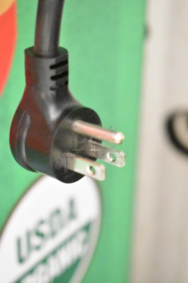 Close-up of the power plug for the True TVM-48SL-HC commercial cooler. Plug shows standard prongs for 115 volts, 1 phase connection.