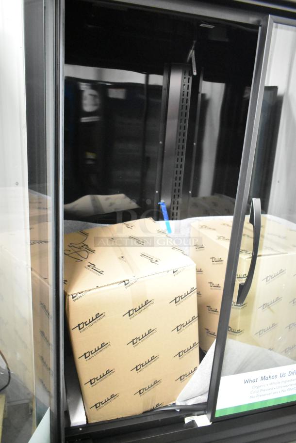 BRAND NEW 2025 True TVM-48SL-HC 2 Door Reach In Cooler Merchandiser, 115 Volts, Scratch and Dent, True branding visible.