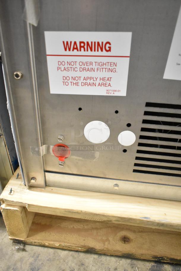 BRAND NEW SCRATCH AND DENT Ice-O-Matic ICEU220FA5 undercounter ice machine, 115 volts, warning label visible.