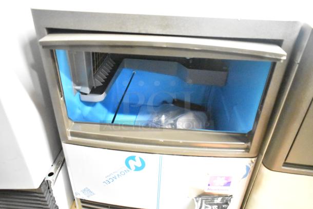 Brand new Manitowoc UDP0065A-161 undercounter ice machine, 2025 model, 115 volts, showing internal ice compartment.