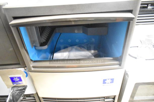 Brand new 2025 Manitowoc UDP0065A-161 undercounter ice machine, scratch and dent. 115V, 1 Phase. Visible Manitowoc logo.