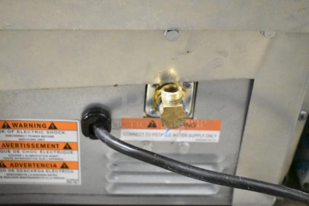 BRAND NEW Manitowoc UDP0065A-161 undercounter ice machine, 115V, warning labels visible, slight scratches, self-contained.