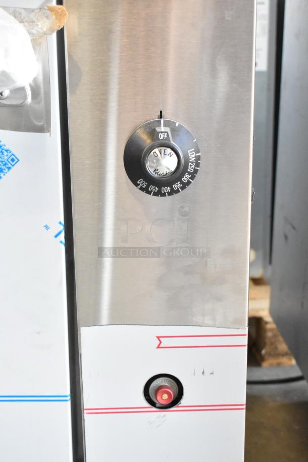 Vulcan thermostatic control panel of 72SS-6B36GTN range, shows oven temperature dial and scratch on stainless surface.