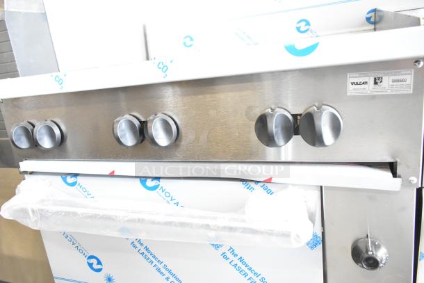 Brand new Vulcan 72SS-6B36GTN range, 6 burners, 36" griddle, 2 ovens, 310,000 BTU, scratch and dent condition.
