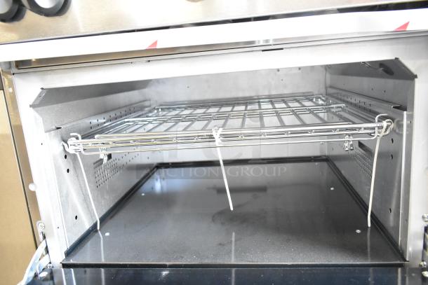 Interior of Vulcan 72SS-6B36GTN commercial range, showing new oven rack and clean surfaces.