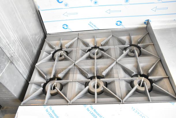 Brand new Vulcan 72SS-6B36GTN commercial range with 6 burners, 36" griddle, and 2 ovens. Natural gas, 310,000 BTU. Scratch and dent.