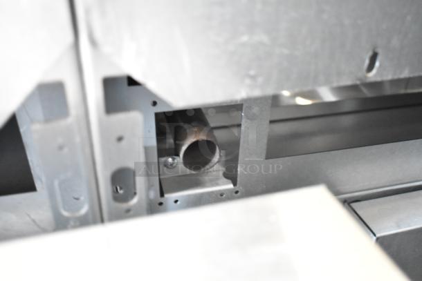 Close-up of interior metal components of a Vulcan 72SS-6B36GTN commercial range, showing new condition.