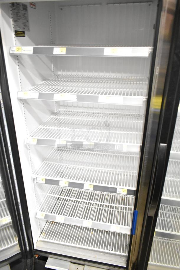 2018 True GDM-72F-HC commercial 3-door reach-in freezer with wire shelving, visible power label, good condition.