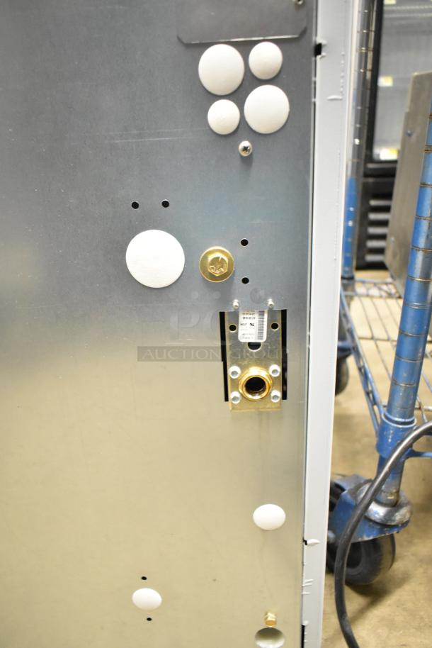 BRAND NEW Scotsman MC1030SR-3A ice machine, remote-cooled, 996 lb capacity. Scratch and dent condition, visible connection ports.