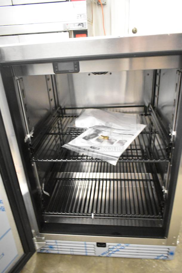 Brand new Perlick HC24FS4S-00-BLFLR undercounter freezer, single door, 115V, 1 phase, visible interior racks.