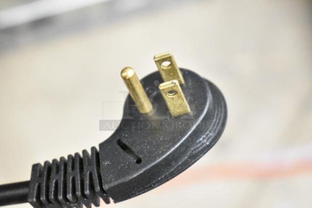Close-up of three-prong plug for a brand new Perlick HC24FS4S-00-BLFLR commercial undercounter freezer, 115V, 1 phase.