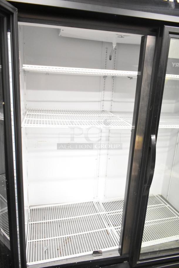 2020 True GDM-49-HC commercial 2-door cooler merchandiser. Features glass doors, adjustable shelves, 115 volts, 1 phase.