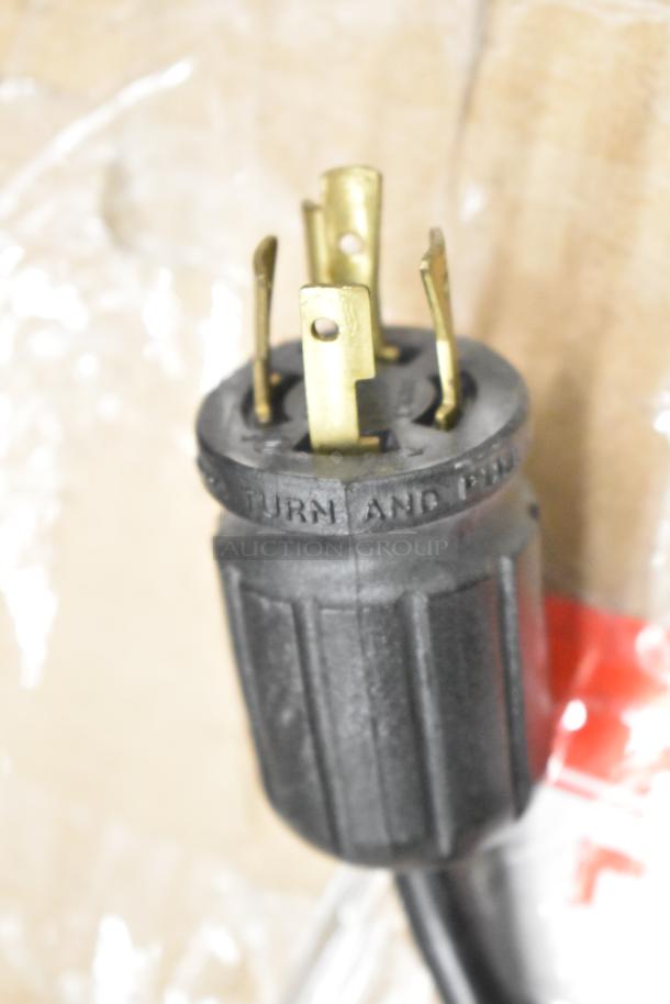 Close-up of the plug for the True GDM-49F-HC freezer, showing prongs and "Turn and Pull" text on the black grip.