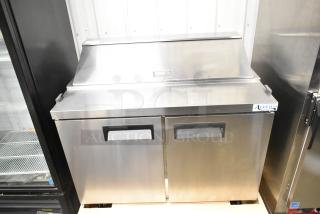 Alt Text: "Brand new Avantco 178APT48HC commercial sandwich salad prep table, stainless steel, with scratch and dent. 115 Volts, 1 Phase."