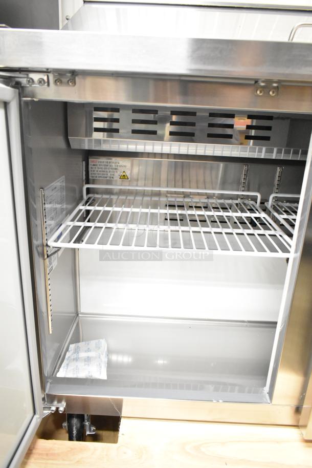 Brand new Avantco 178APT48HC commercial prep table, 2025 model, 115V, scratch and dent, empty interior with wire shelf.