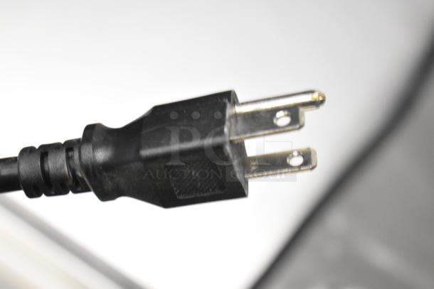 Close-up of a two-prong black electrical plug for the Avantco 178APT48HC commercial prep table, 115 volts, 1 phase.