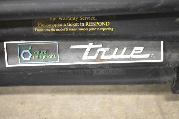 2020 True GDM-49-HC commercial cooler, 2 doors, natural refrigerant label, 115V, 1 phase, warranty info visible.