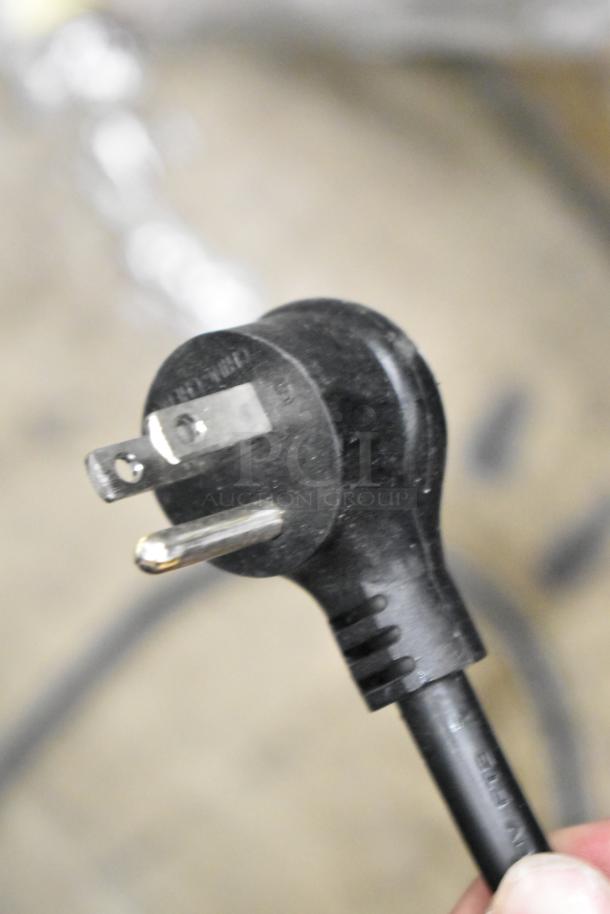 Close-up of a power plug for the True GDM-49-HC Commercial Cooler, compatible with 115 volts, 1 phase.