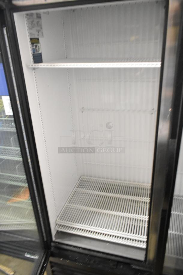 2020 True GDM-49F-HC commercial cooler, dual glass doors, white interior, shelves, excellent condition, 115V, 1 phase.