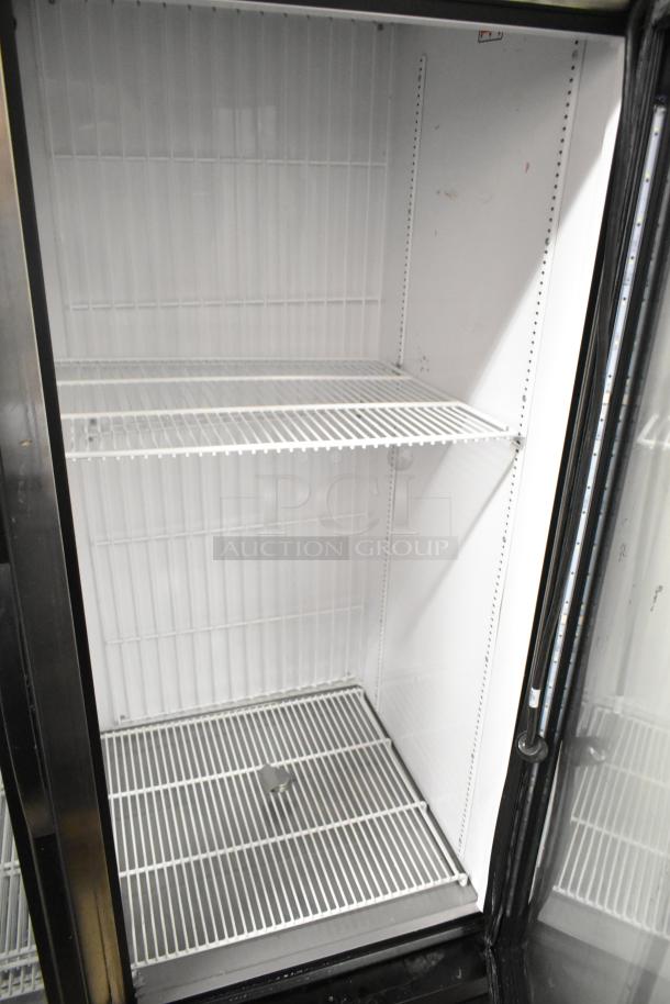 2020 True GDM-49F-HC commercial cooler, 2 glass doors, white interior, metal shelves, 115 Volts, excellent condition.
