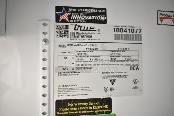 2020 True GDM-49F-HC cooler label with model, voltage, and refrigerant details. Made in USA, serial number 10041077.