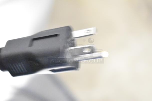 Close-up of a three-prong power plug, part of the Solwave 180MW1200TA stackable commercial microwave, 120V, 1 Phase.