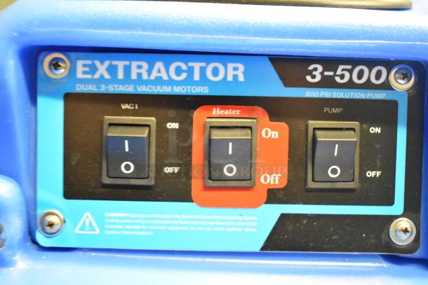 Alt text: "Lavex Dual 3-Stage Heated Carpet Extractor control panel with switches for VAC, Heater, and Pump, labeled 500 PSI."