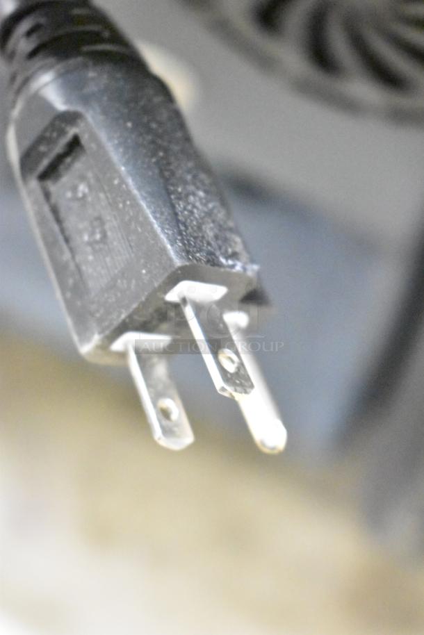 Plug detail of Lavex Dual 3-Stage Heated Carpet Extractor with 25' hoses and 12" stainless steel wand, 500 PSI, 12-gallon.