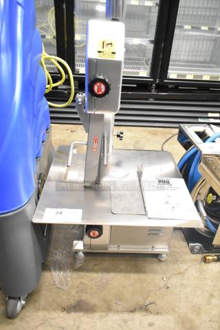 Brand new Backyard Pro 554BSSW65AL Butcher Series 65" blade vertical band meat saw, 110V, with manual, scratches visible.