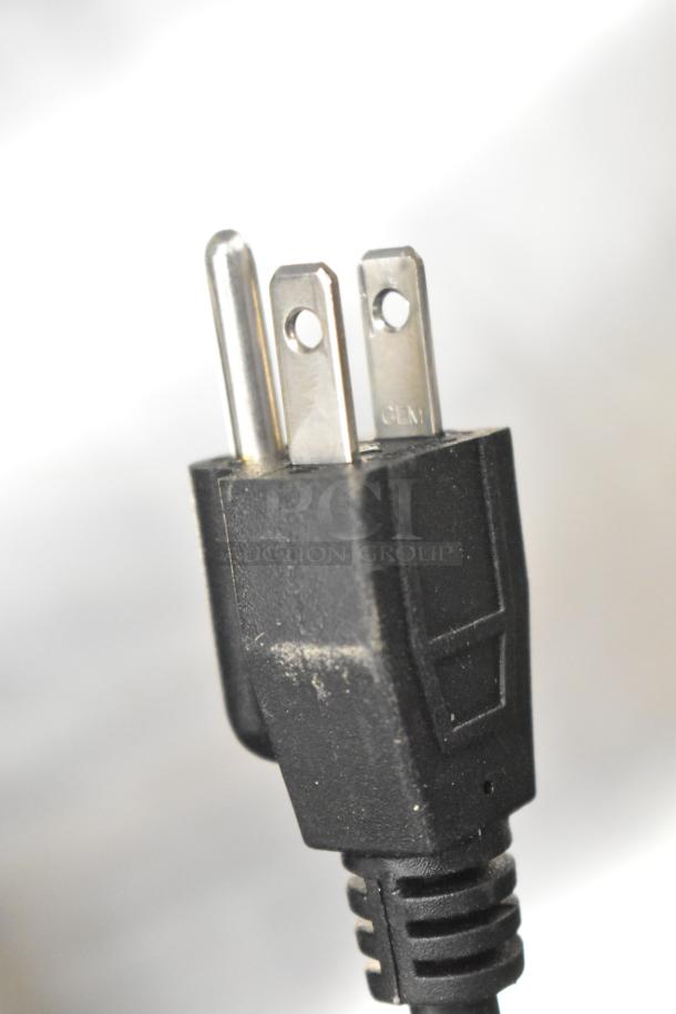 Close-up of a 3-prong plug for the Backyard Pro 554BSSW65AL Butcher Series meat saw, 110V, brand new condition.