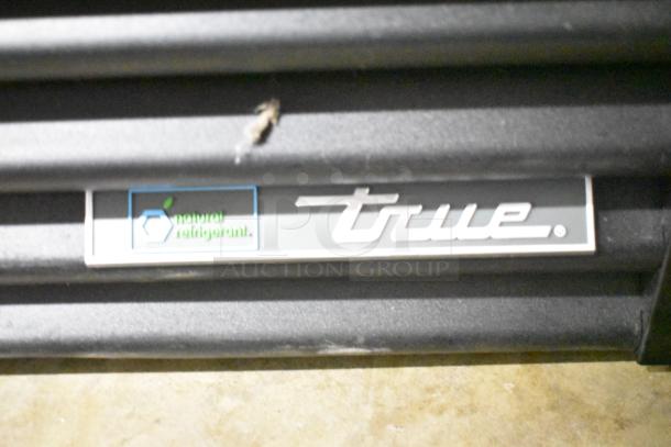 2025 True GDM-12F-HC Cooler Merchandiser, silver label with “natural refrigerant” and True logo.