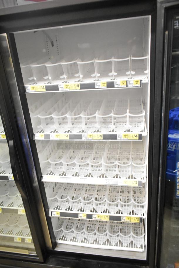 2018 True GDM-49-HC Commercial 2 Door Reach-In Cooler Merchandiser, 115V. Features glass doors, white interior shelves.