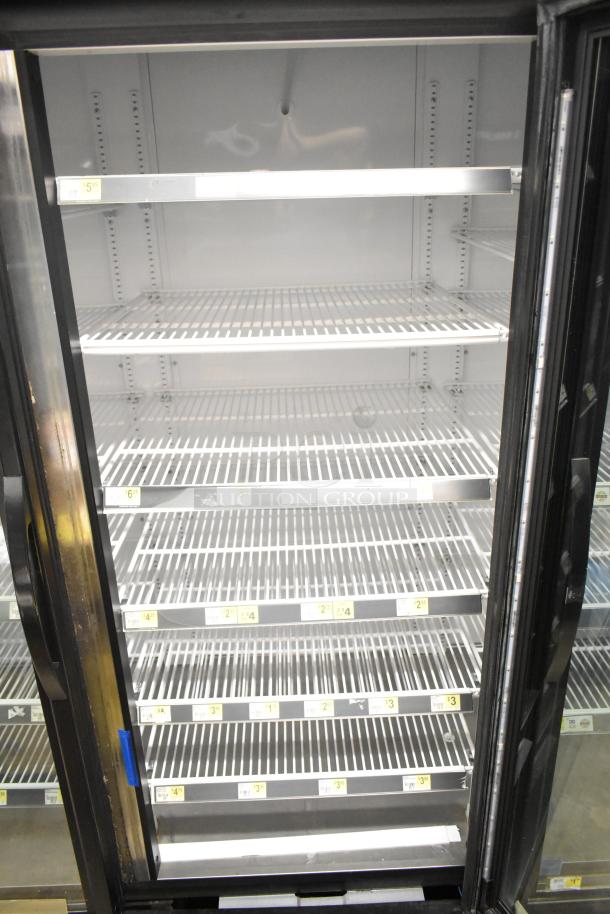 2018 True GDM-72-HC commercial cooler, 3-door reach-in, shelving intact, 115 volts, 1 phase, clean interior.