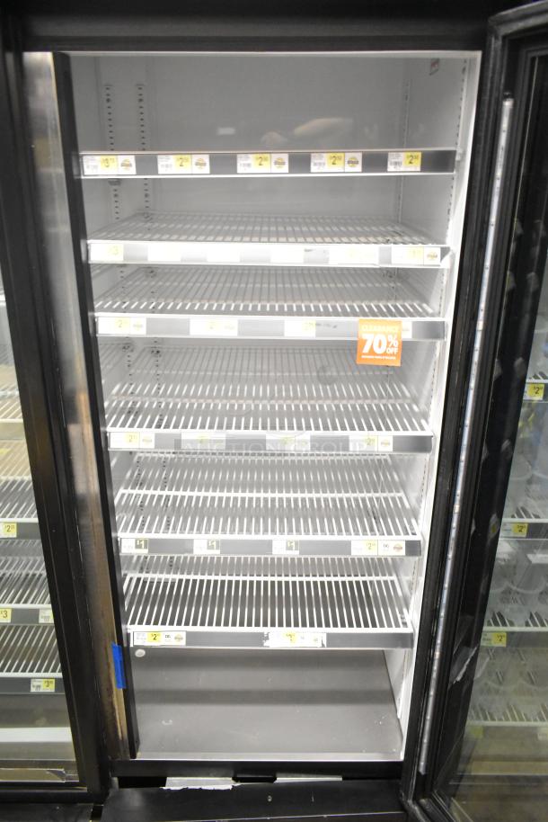 2018 True GDM-72-HC commercial 3-door reach-in cooler merchandiser. Features adjustable shelves, 115V, 1 phase.