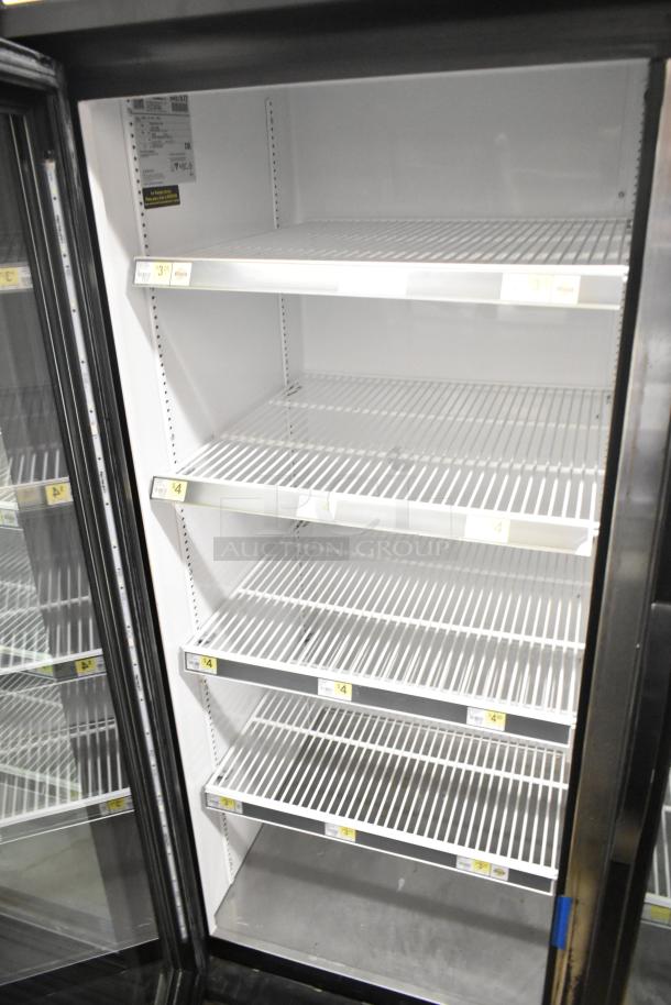 2018 True GDM-72-HC commercial 3-door cooler, 115V, 1 phase, with multiple shelves, clean interior. Model label visible.