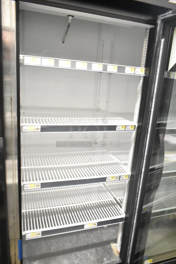 2018 True GDM-72-HC commercial 3-door cooler merchandiser, 115V, 1 phase, with shelving, good condition.