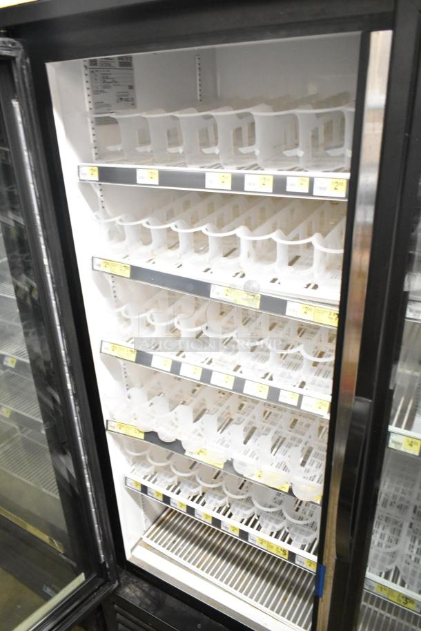 2018 True GDM-72-HC commercial 3-door reach-in cooler, 115 volts, 1 phase, shelves visible, used condition.